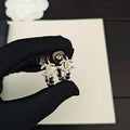 18K Chanel Diamond Cirle Leather Earrings