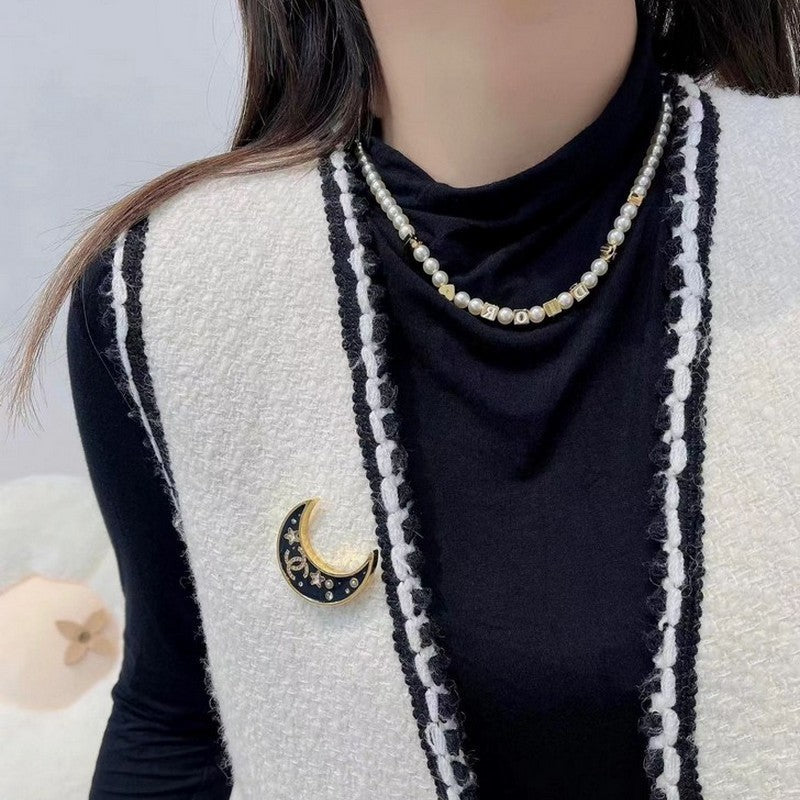 18K Chanel 25K Black Moon Brooch