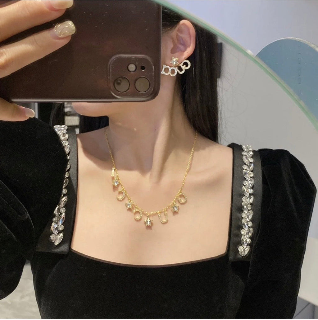 18K Gucci Script Star Earrings